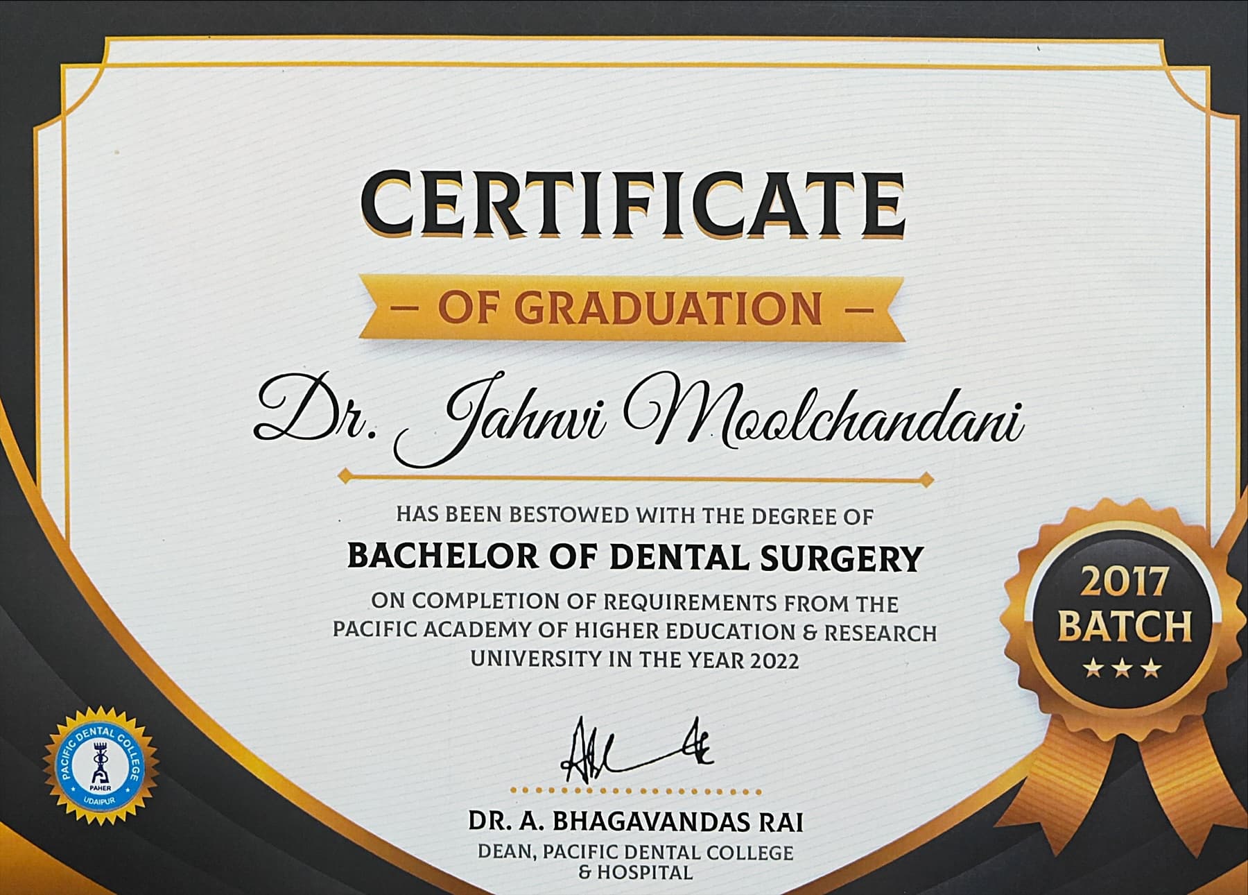 Certificate of graduation for the degree of Bachelor of Dental Surgery from Pacific Academy of Higher Education and Research University, conferred in 2022 and signed by the Dean of Pacific Dental College and Hospital